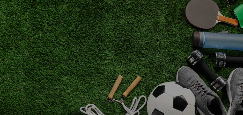 Thematic image with mixed sports equipment on grass